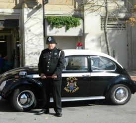 A police officer standing in front of the Saint John Police Museum