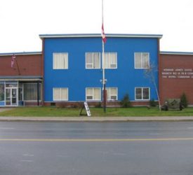 The Bathurst War Museum, a large brick building with a blue front façade and an off-centre entrance