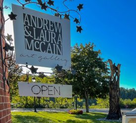 'Andrew & Laura McCain Art gallery' open sign